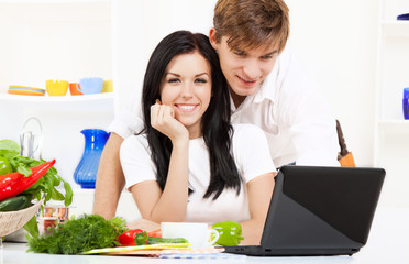 young couple in kitchen