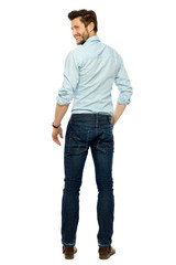 Rear view of young man standing