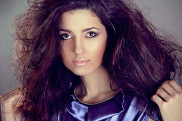 Naklejka premium Fashion brunette woman model with long hair in motion. Beauty an