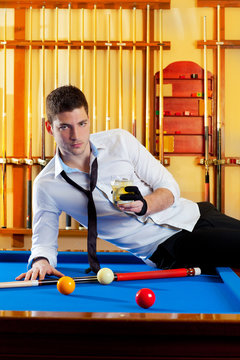 Billiard handsome player man drinking alcohol