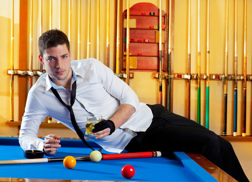 Billiard handsome player man drinking alcohol