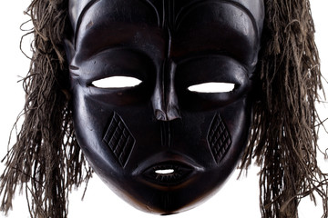 Black tribal face mask on white background