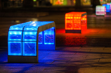 Illuminated multicolored benches at night in Hannover, Germany
