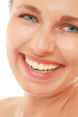 Obraz premium Closeup of a beautiful young woman smiling, isolated on white