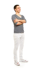 A full-length portrait of a young smiling guy