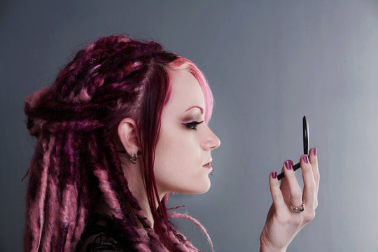 Portrait of woman with dreadlocks hair