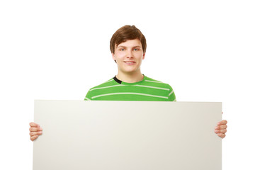 A young college guy holding a blank, isolated on white