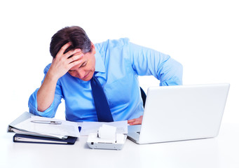 Busy businessman with laptop computer.