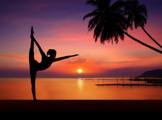 Silhouette of Yoga girl in sunset