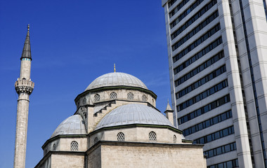 Fototapeta na wymiar Mosque With Modern Skyscraper On Background, Istanbul, Turkey