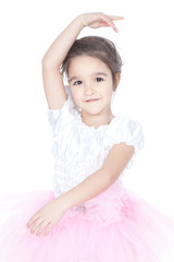 Beautiful little dancer, ballerina in pink dress over white