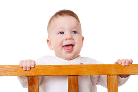 Smiling Baby Standing In Bed