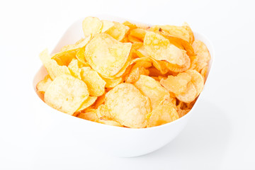 Potato chips in plate on white background