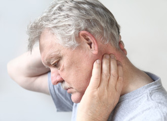 senior man with sore neck
