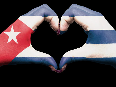 Heart and love gesture by hands colored in cuba flag for tourism