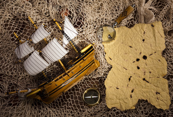 Naklejka na ściany i meble Old navigation instrument, map and compass