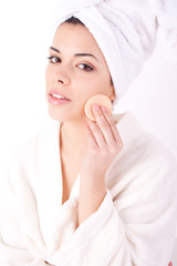 beautiful woman with perfect skin - Applying clean sponge.