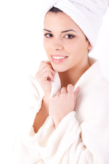 Beautiful healthy young brunette woman in a white spa bath robe