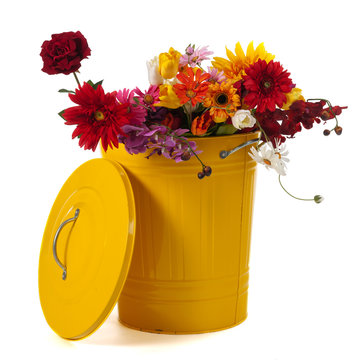 Yellow trash can with flowers