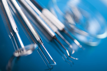 Dentist equipment on blue background