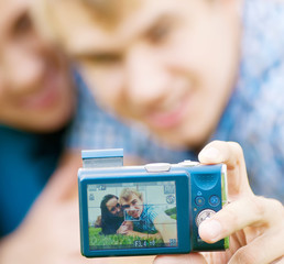 Happy teenage couple taking picture