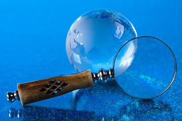 Globe and Magnifying glass