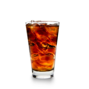 Cola with ice cubes over white background