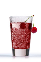 cherry juice in glass with ice cube, on white background