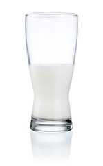 Half a glass of fresh milk isolated on a white background