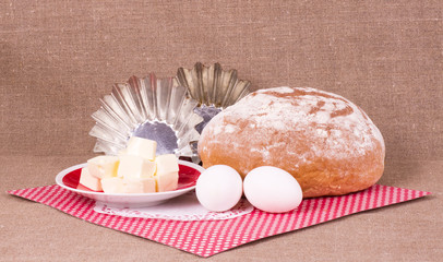 Obraz na płótnie Canvas Baking cake, margarine and eggs on background