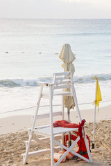 Lifeguard Stand on Beach with Yellow Caution Flag