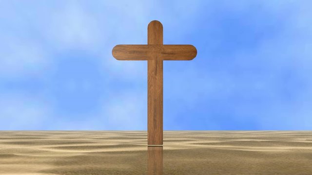A wooden cross in the middle of a desert of sand
