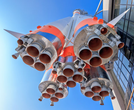 Details of space rocket engine over blue sky background
