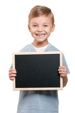 boy at blank chalkboard