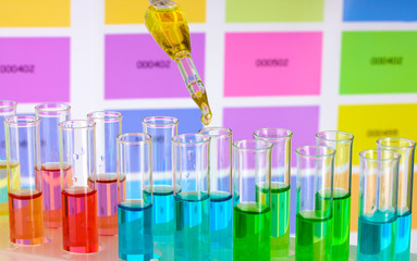 Test-tubes with color liquid and pipette