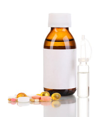 Medical bottles with tablets and ampoules isolated on white