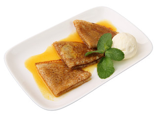 pancakes in orange sauce with ice cream