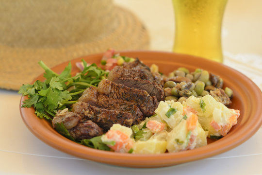 BBQ Beef -Grilled beef with potato salad, salsa & black eyed pea