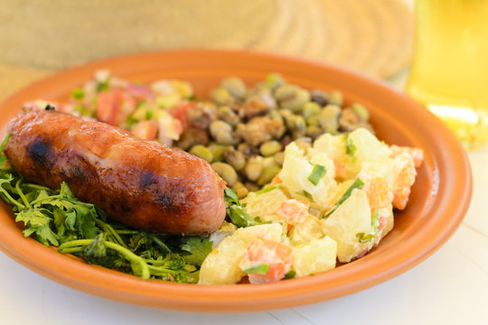 BBQ Sausage - Grilled sausage served with potato salad and salsa
