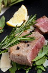 Beef on arugula salad and parmesan