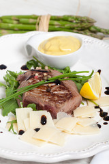 Beef on arugula salad and parmesan