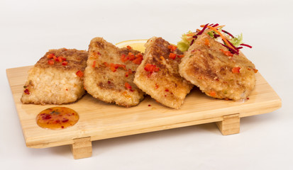 Fried fish fillets with  salad.