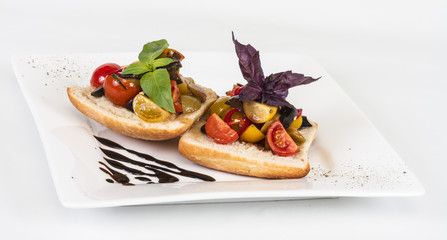 juicy tomatoes on fresh bread, pesto as topping