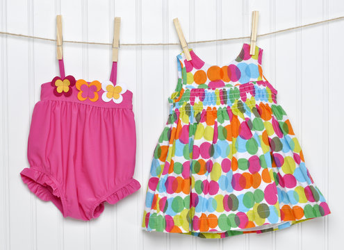 Baby Dress And Bathing Suit On A Clothesline