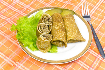 Stuffed fried pancakes with meat .
