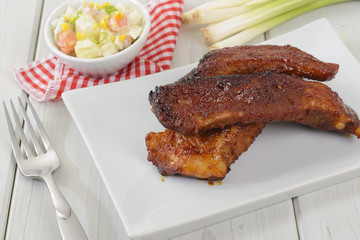 BBQ Pork Ribs - BBQ pork spare ribs served with potato salad