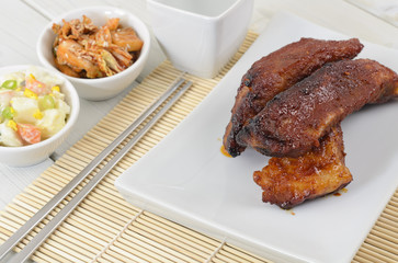Daeji Galbi - Grilled Korean pork ribs with banchan & soju