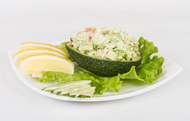 Crab meat salad with green caviar in avocado - japan cusine