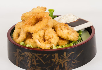 Deep batter fried squid rings calamari with green salad