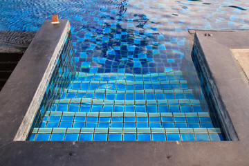 A swimming pool with stairs.